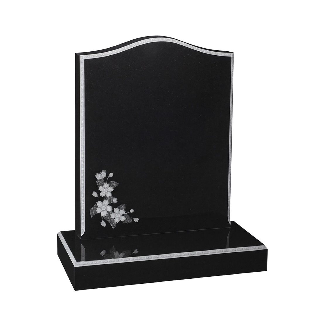 Black headstone with a fine light border and floral decoration