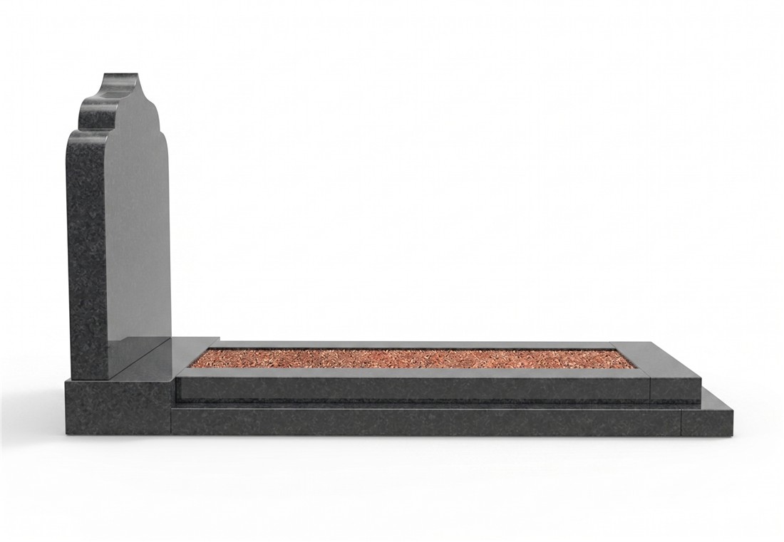 A grey stepped surround framing a bed of warm-toned chippings.