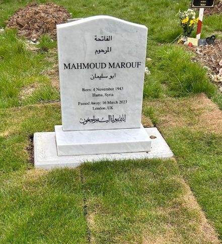 Pale headstone on a rectangular base