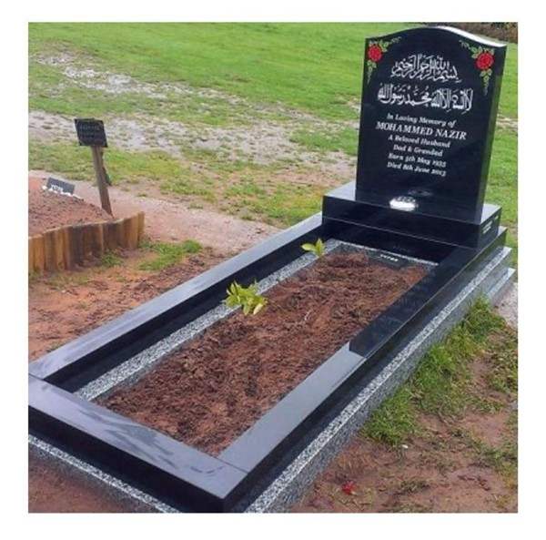 Dark headstone with reddish chippings