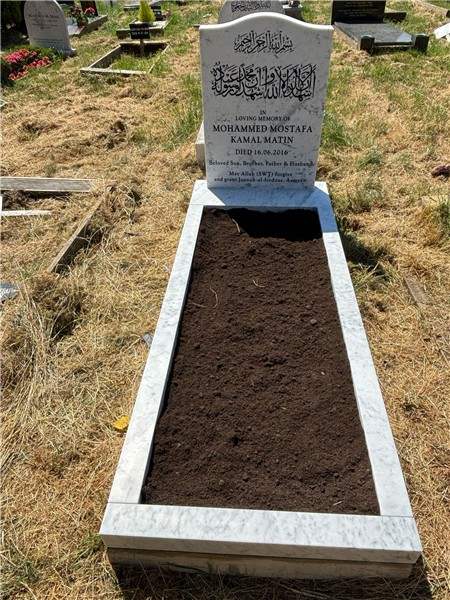 Pale headstone with an open surround
