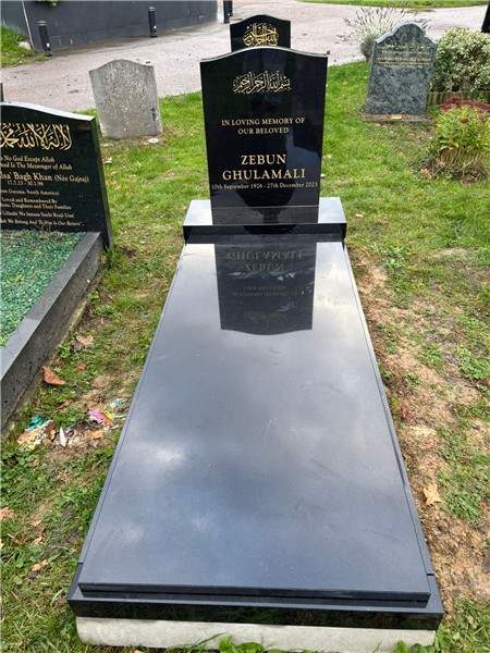 Dark headstone and full cover