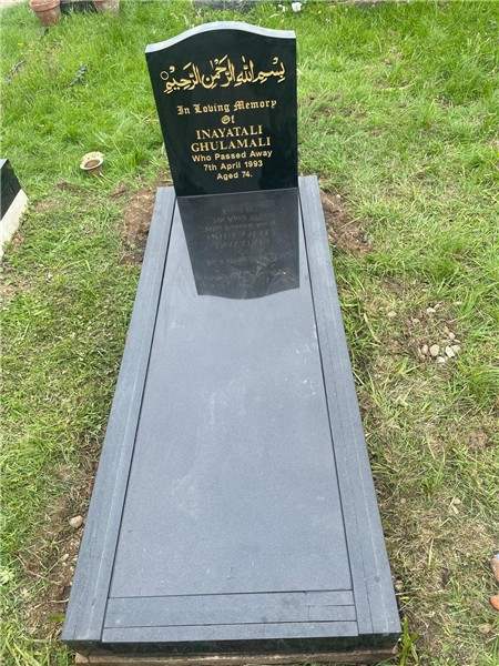 Dark headstone with a light full cover
