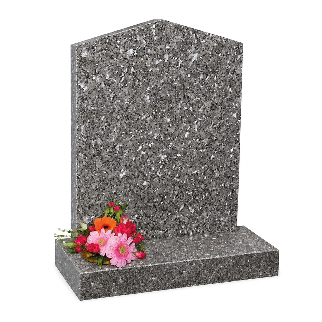 A speckled headstone with an angled crown and a flower holder.